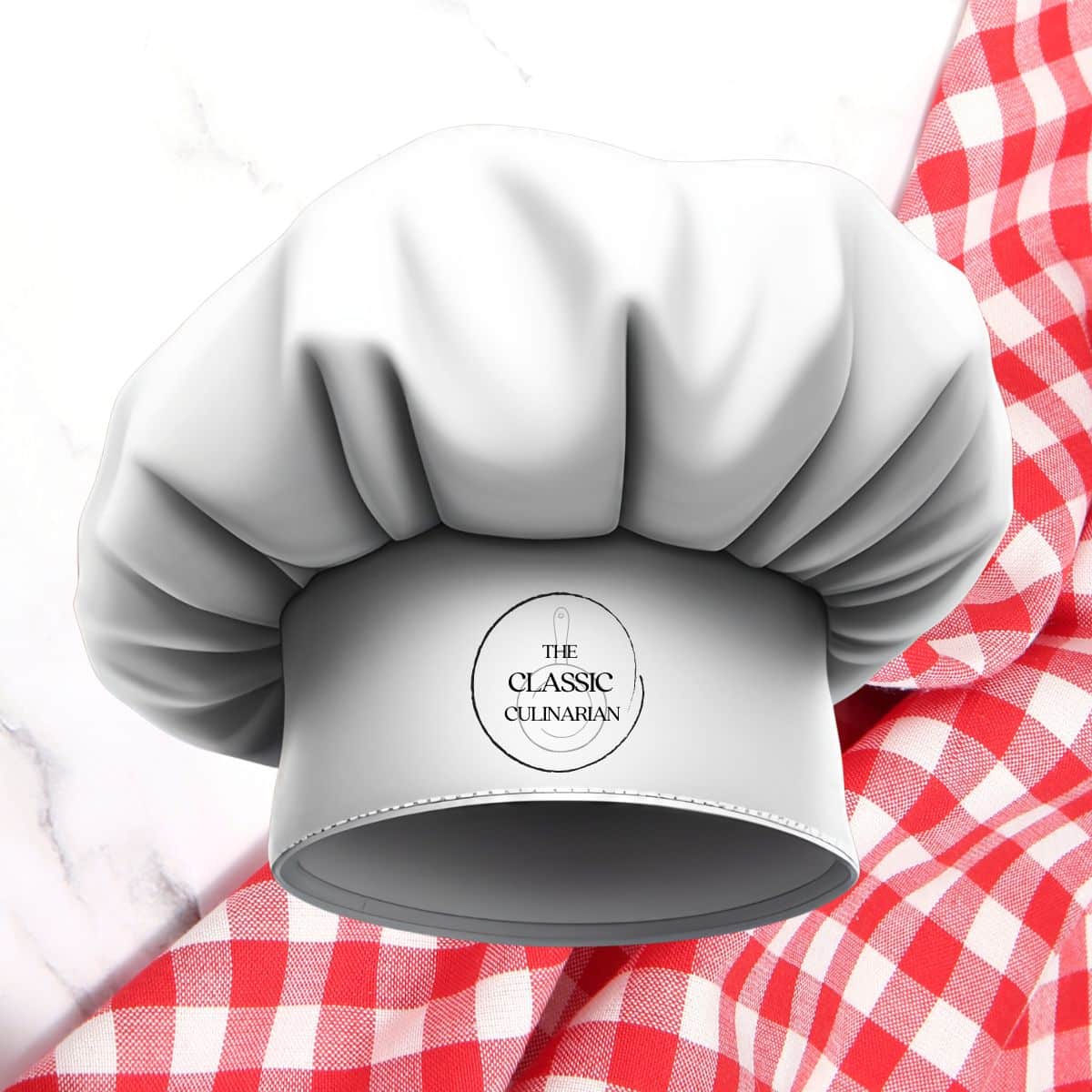 Image of The Classic Culinarian toque with a red & white gingham cloth background.